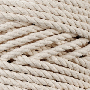 Close-up of twisted natural cotton macrame rope fiber texture