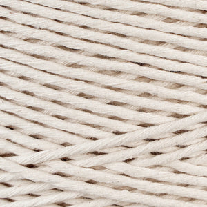 Close-up of single strand natural cotton macrame fiber texture