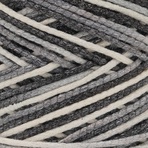 Macro shot of cotton filling inside metallic braided structure