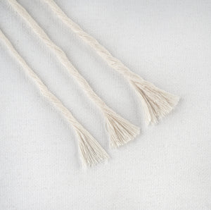 Macro shot of soft cotton fibers in macrame string